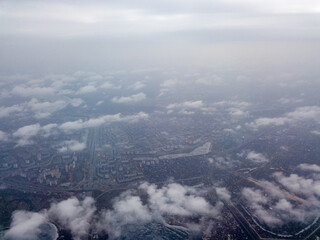 Fototapeta premium Aerial high view. Flight over the clouds of Kiev.
