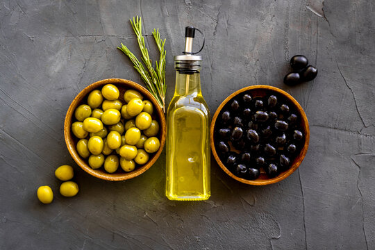 Olive Oil In Bottle With Green And Black Olives, Top View