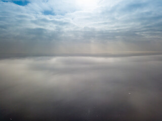Obraz na płótnie Canvas Aerial high view. Flying over the clouds.