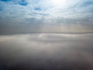 Aerial high view. Flying over the clouds.