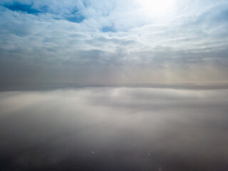 Aerial high view. Flying over the clouds.