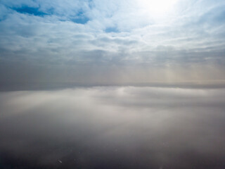 Aerial high view. Flying over the clouds.
