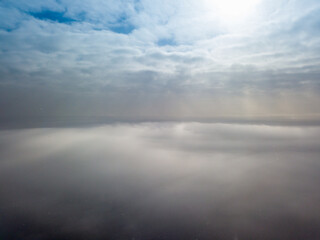 Aerial high view. Flying over the clouds.