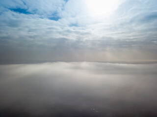 Aerial high view. Flying over the clouds.