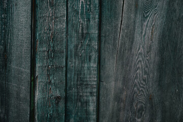 Old wooden fence with shabby paint. Background. Wood texture