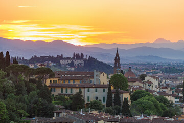 Fototapeta na wymiar Cityscape view at Florence in evening light with the mountains