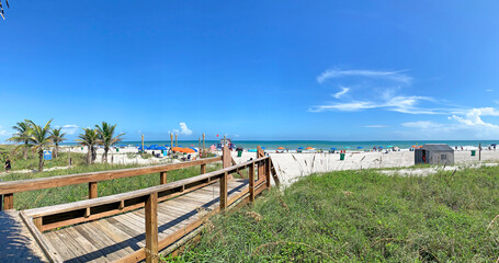 View of the beach from the boardwalk at Cocoa Beach Florida during Spring Break in Brevard County on the Space Coast. 