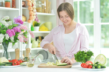 teen girl preparing fresh salad