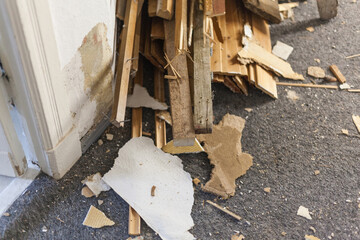 Stacked wood scraps from paneling and interior fittings are temporarily stored during the...