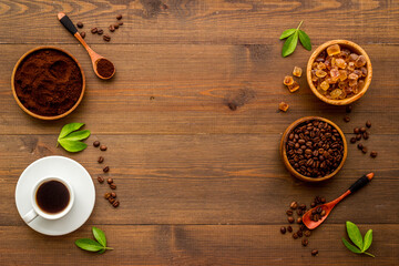 Top view of diffetent varieties of coffee beans with hot drink, top view