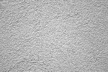 gray textured plaster wall of the house