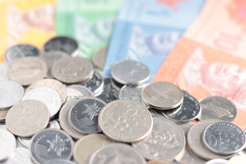 close up view of Malaysian Ringgit MYR coins currency, cents, banknote, paper money. selective focus.