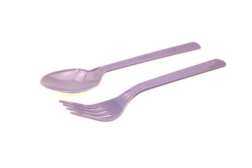 Plastic spoon and fork on white background