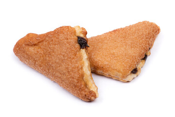 Group of triangular pastries with raisins