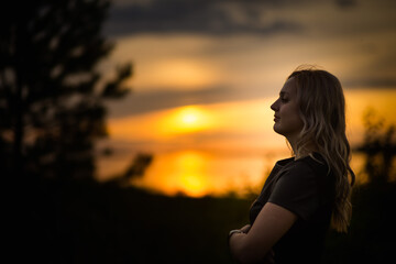 blonde girl at sunset, selective focus