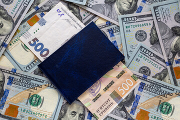 American dollars and Ukrainian hryvnia with a passport during the crisis.