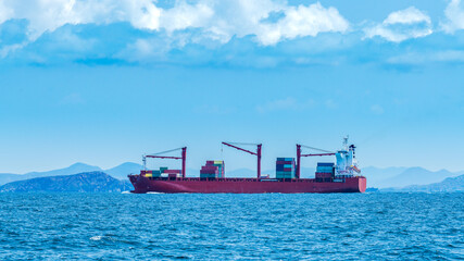 Cargo shipping transportation logistic commerce industry loading export on sea with blue cloud sky background.