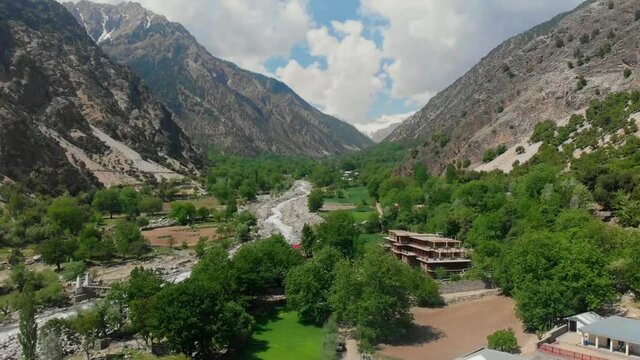 Aerial View Of Valley Surrounded By Hindu Kush Mountain Range. Pedestal Down