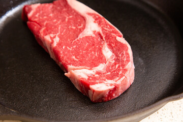 Red meat steak in a cast iron pan