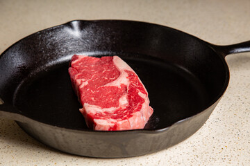 Red meat steak in a cast iron pan