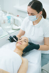 Facial application of microcurrent machine in beauty treatment