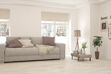 White living room with sofa and winter landscape in window. Scandinavian interior design. 3D illustration