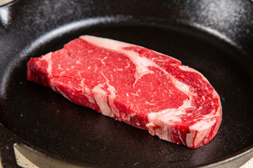 Red meat steak in a cast iron pan