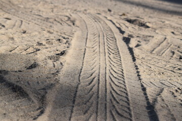 Fototapeta na wymiar a tire mark in the sand