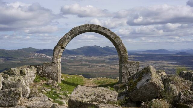 Beautiful antique arch of a chapel church ruin with landscape on the background in Monsanto, Portugal