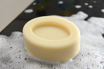 Mockup oval shape soap on foam bubbles