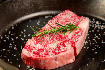 Red meat kosher organic steak in a cast iron skillet potatoes