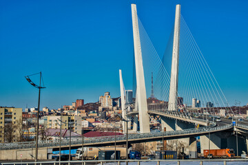 Fototapeta na wymiar golden bridge in Vladivostok city on a clear, sunny day 