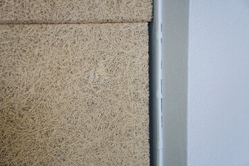 The gaps formed between the joints of the  Sound Absorption panels and the cement column. construction problems.