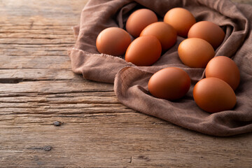 Heap of Chicken eggs on old wood table background