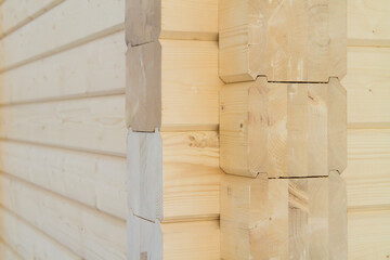 Building a house from a wooden beams. wall of wooden glued beams. Eco House construction. 