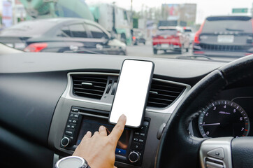 Fototapeta na wymiar Mobile phone on the car air vent.Blank with white screen.Mock up smart phone in car.