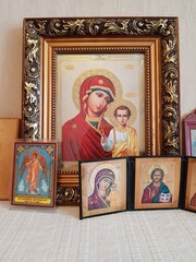 Fototapeta premium Antique Orthodox Christian icons on the shelf