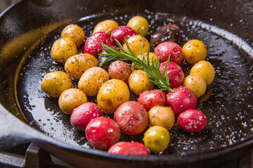 Small colorful potatoes in a skillet cast iron pan