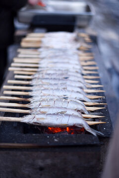 Steckerlfische - eine gegrillte Fischspezialit&auml;t im Salzkammergut, &Ouml;sterreich, Europa - Stick fish - a grilled fish specialty in the Salzkammergut, Austria, Europe