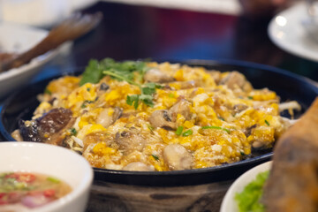 Oyster omelette served in hot pan