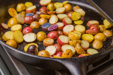 Small colorful potatoes in a skillet cast iron pan