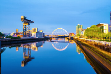 Naklejka premium View of Glasgow, UK landmarks - Finnieston Crane and Squinty bridge at sunset