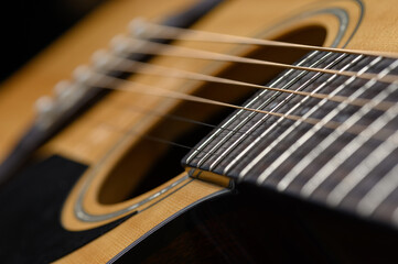Fototapeta premium Acoustic guitar close up. Cover for online courses, learning at home.
