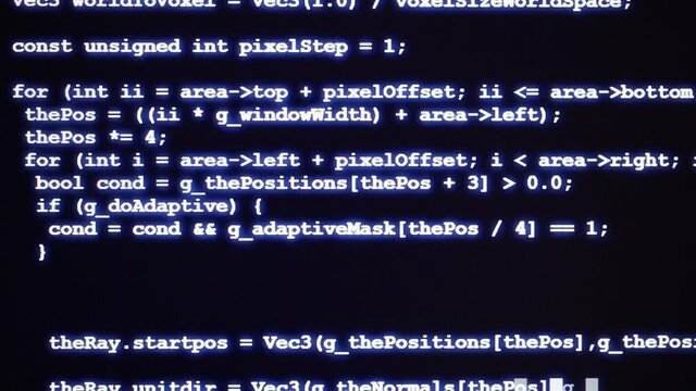 Typing blue source code of computer program on dark display, programming, developer or computer code concept