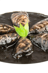 Squid cooked with her ink