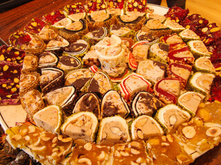 oriental sweets. traditional Turkish baklava with pistachios, Turkish delight, sherbet and halva