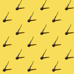 Beauty seamless pattern with brush for make up on trendy yellow background