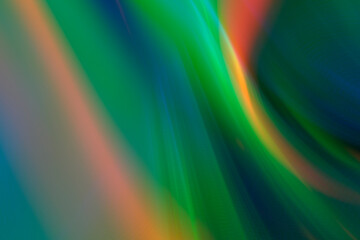 Abstract blurry green background with rainbow glow