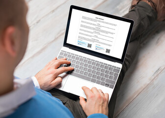 Man using digital signature for signing contract on computer