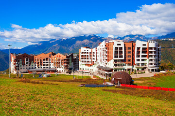Buildings in Rosa Plateau mountain village. Rose Plateau and Roza Khutor are alpine ski resorts near Krasnaya Polyana town in Sochi region, Russia. © saiko3p